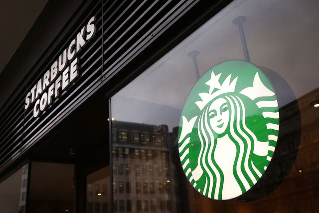 <p>Starbucks sued by worker who claims company did not protect him from racial abuse from a customer</p>