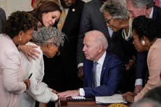 Joe Biden gets down on one knee to welcome ‘grandmother of Juneteenth’ to White House as law is passed