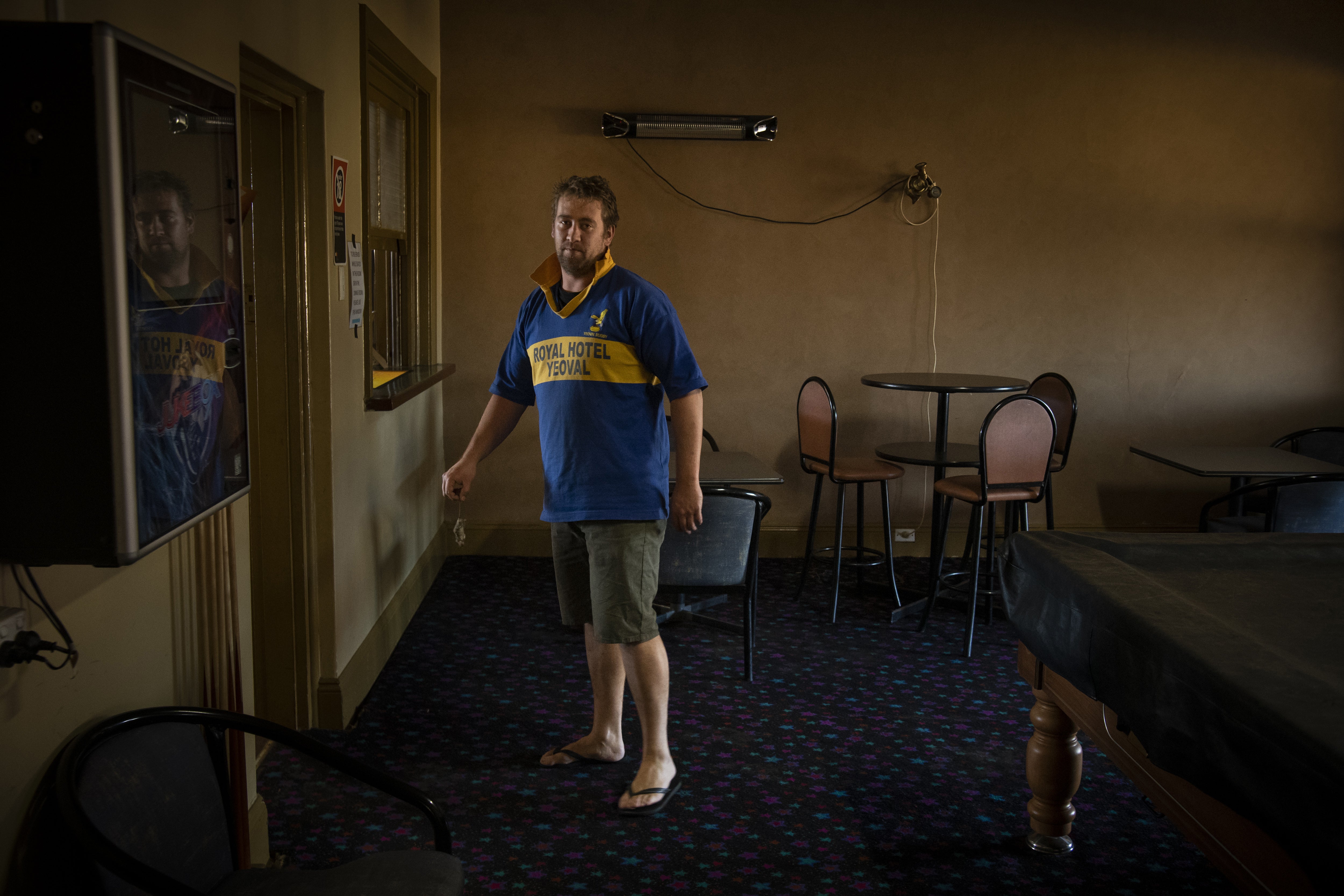 Mark Iles, publican at the Royal Hotel, holds a dead mouse in Yoeval, New South Wales, Australia on 28 May 2021