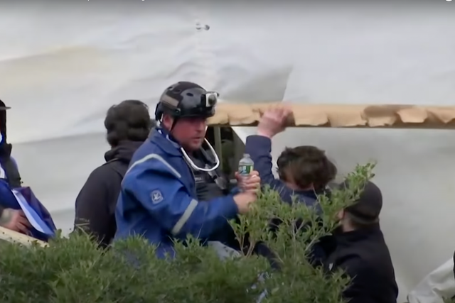 <p>Court documents identified Guy Wesley Reffitt in this picture wearing a blue jacket and helmet with Go-Pro camera</p>