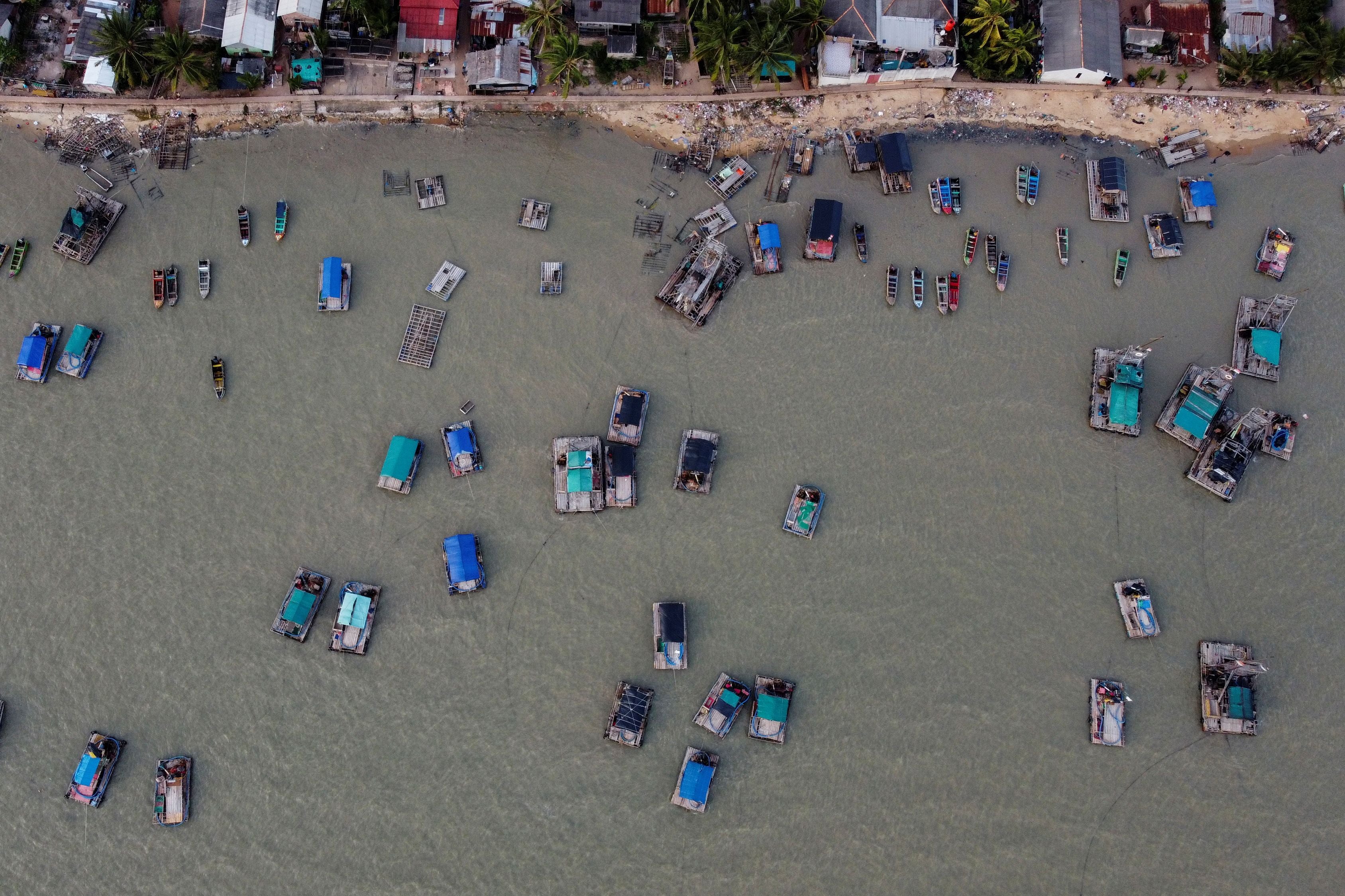 Wooden pontoons along the shore of Toboali