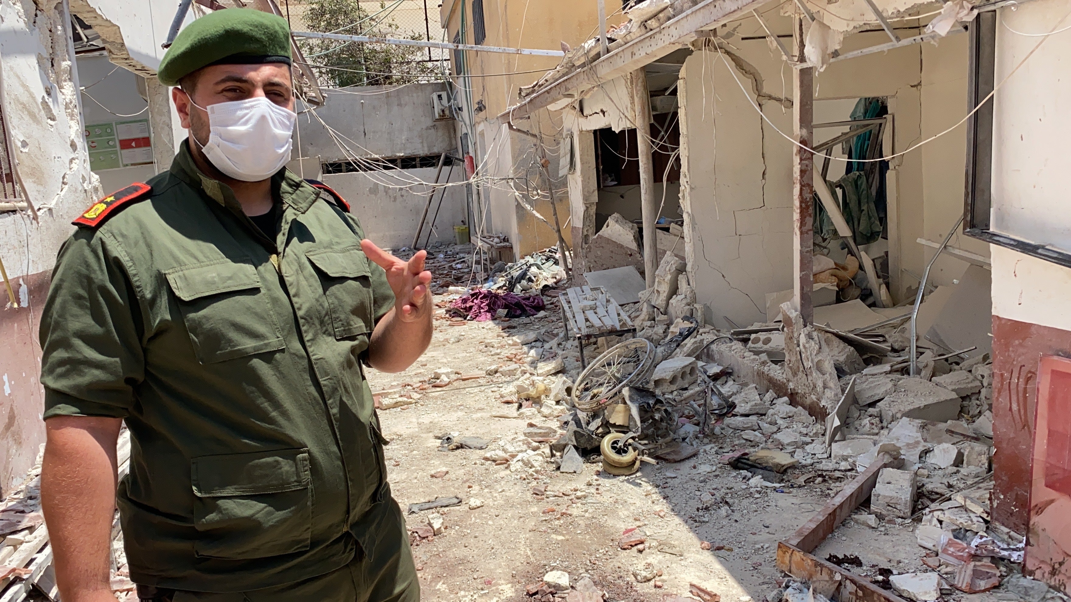 Colonel Mohammed al-Hossein, of the Afrin police, assesses the damage done by a 12 June rocket attack on Al-Shifaa Hospital