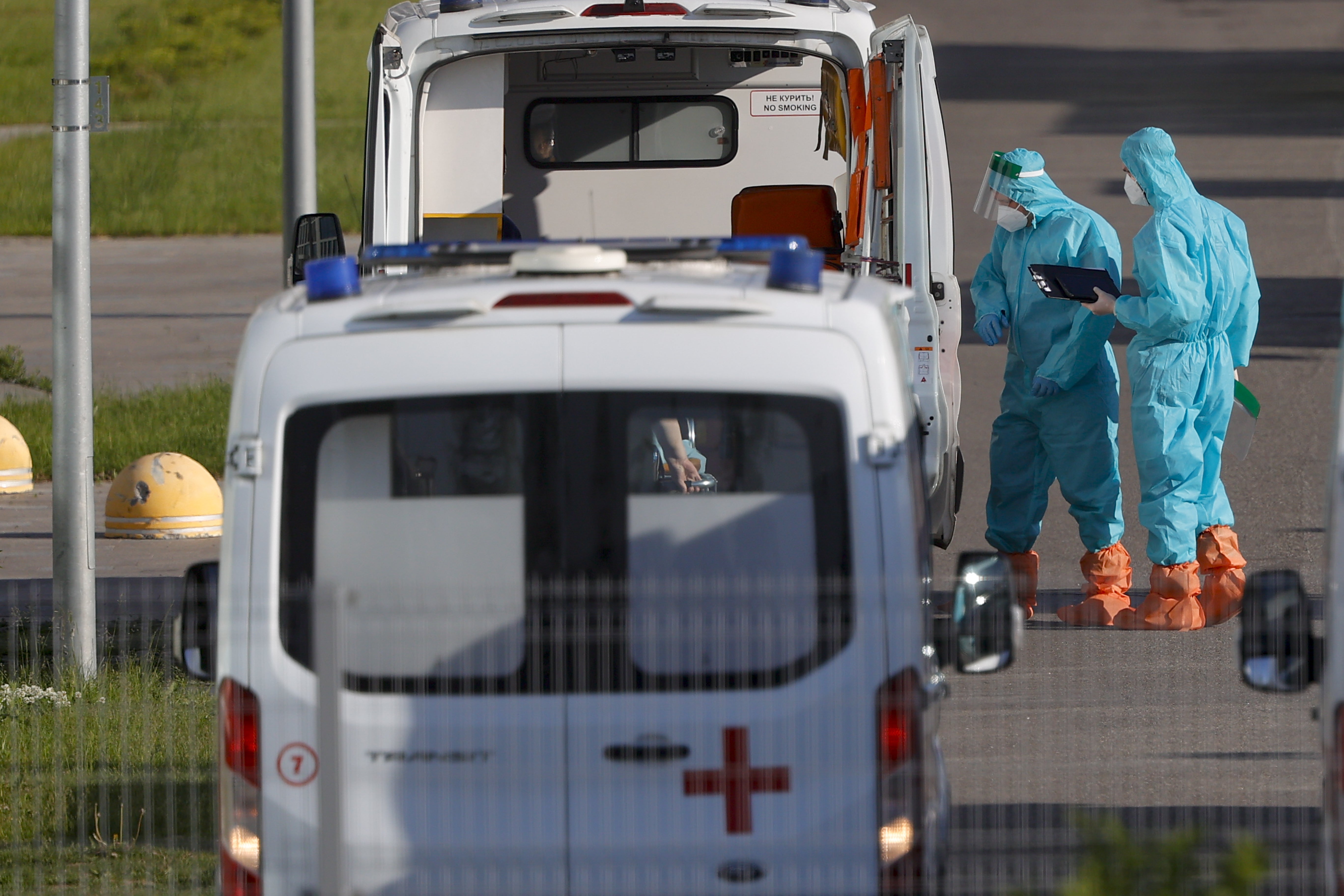 Healthcare professionals, wearing special protective clothing, continue working to combat coronavirus in the capital Moscow
