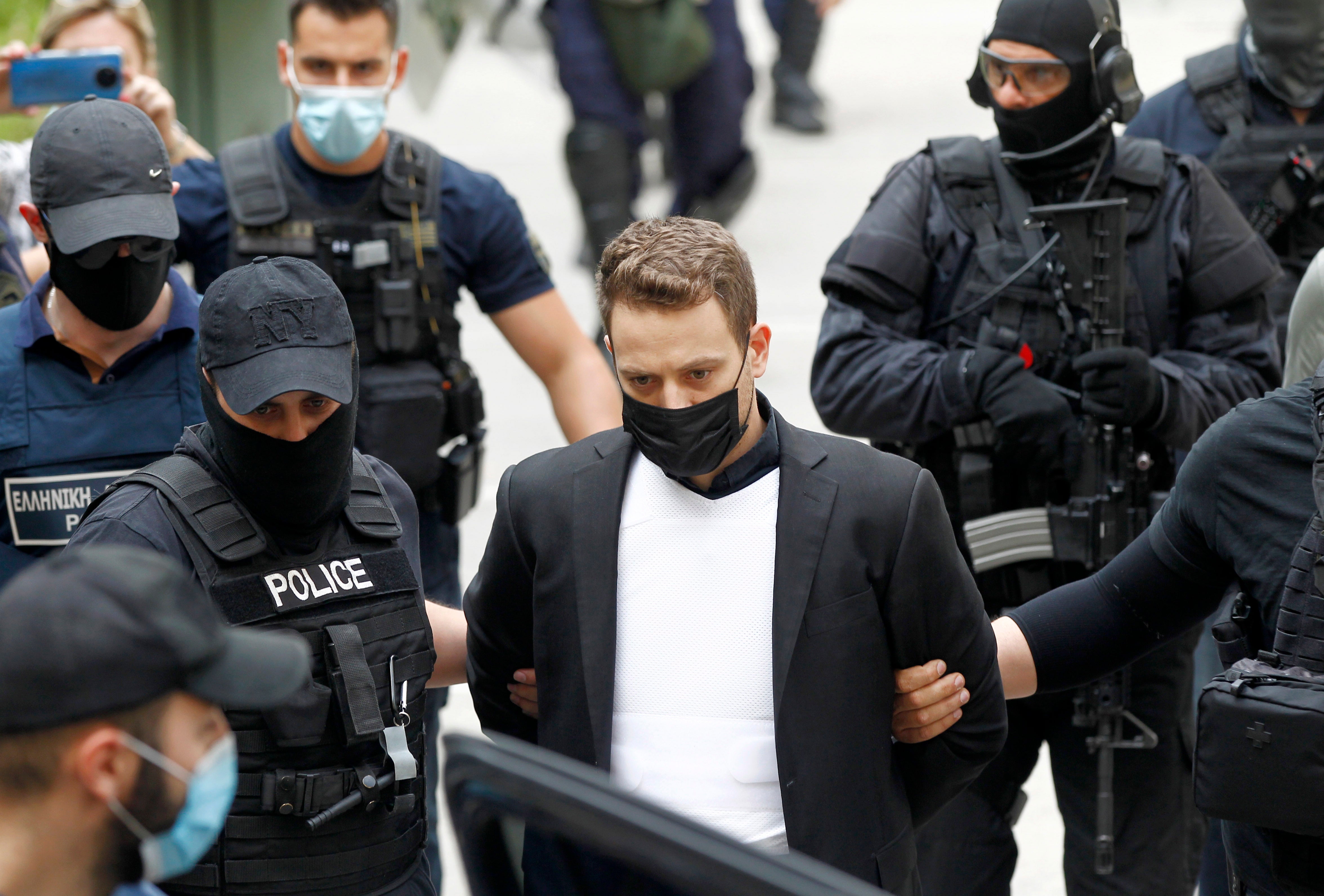 Pilot Babis Anagnostopoulos, husband of murdered Caroline Crouch, leaves the court in Athens