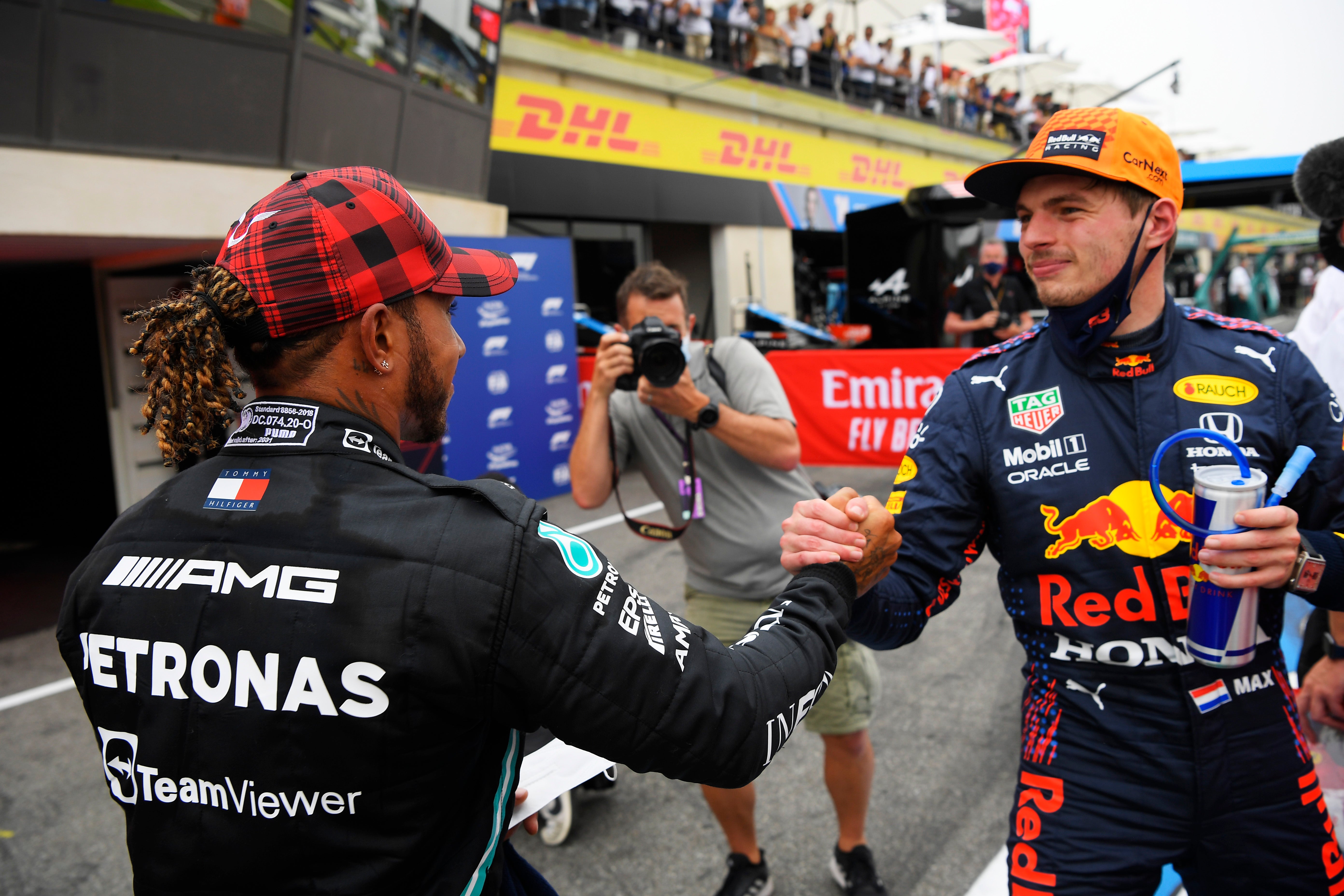 Max Verstappen is congratulated by Lewis Hamilton