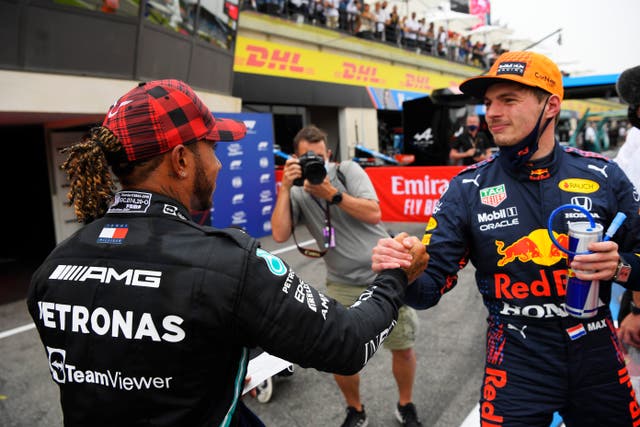 <p>Max Verstappen is congratulated by Lewis Hamilton</p>