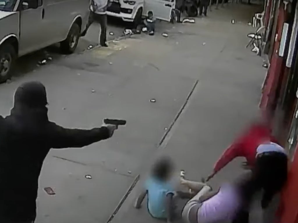 Chilling footage shows two children get caught up in New York shooting