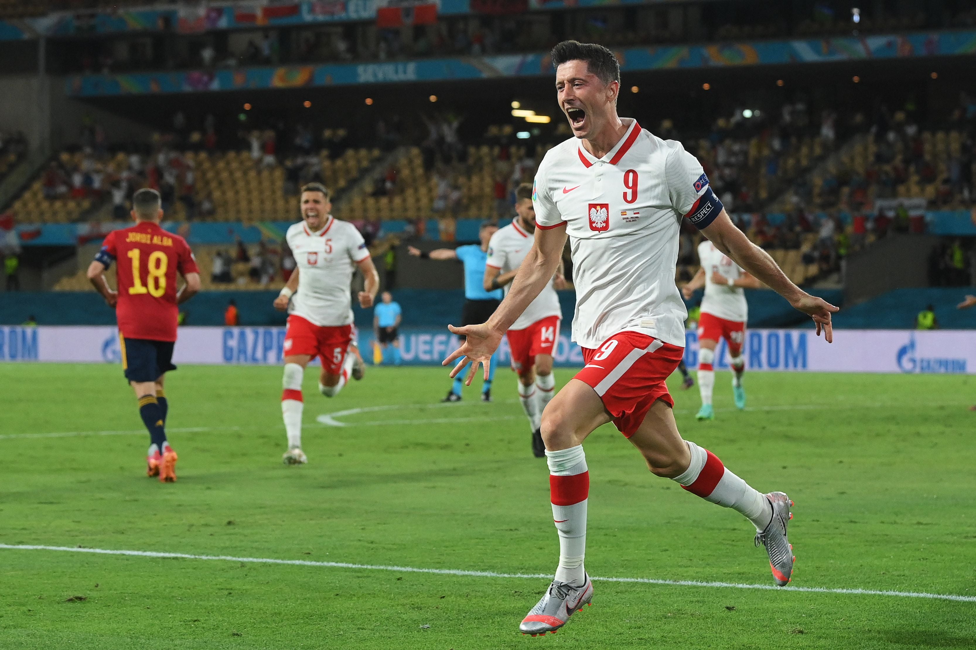 Robert Lewandowski celebrates scoring Poland’s equaliser
