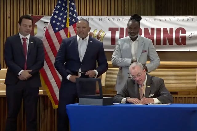 <p>Democratic New Jersey Governor Phil Murphy signs the Fair Chance in Housing Act on 18 June 2021. </p>