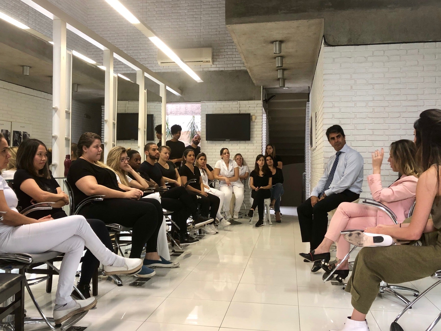 Beauticians from Jacques Janine, a high end salon in São Paulo, being trained to stop domestic violence
