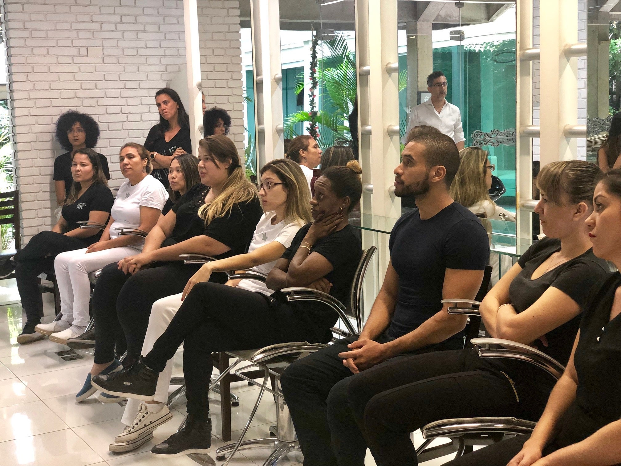 <p>Beauticians from Jacques Janine, a high end salon in São Paulo, being trained to stop domestic violence as part of the Mãos Empenhadas Contra a Violência project in 2019</p>