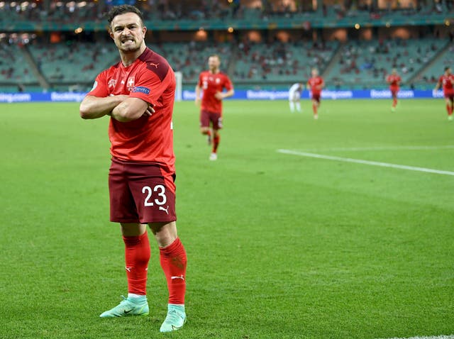 Xherdan Shaqiri celebrates scoring his side’s third goal against Turkey in Baku