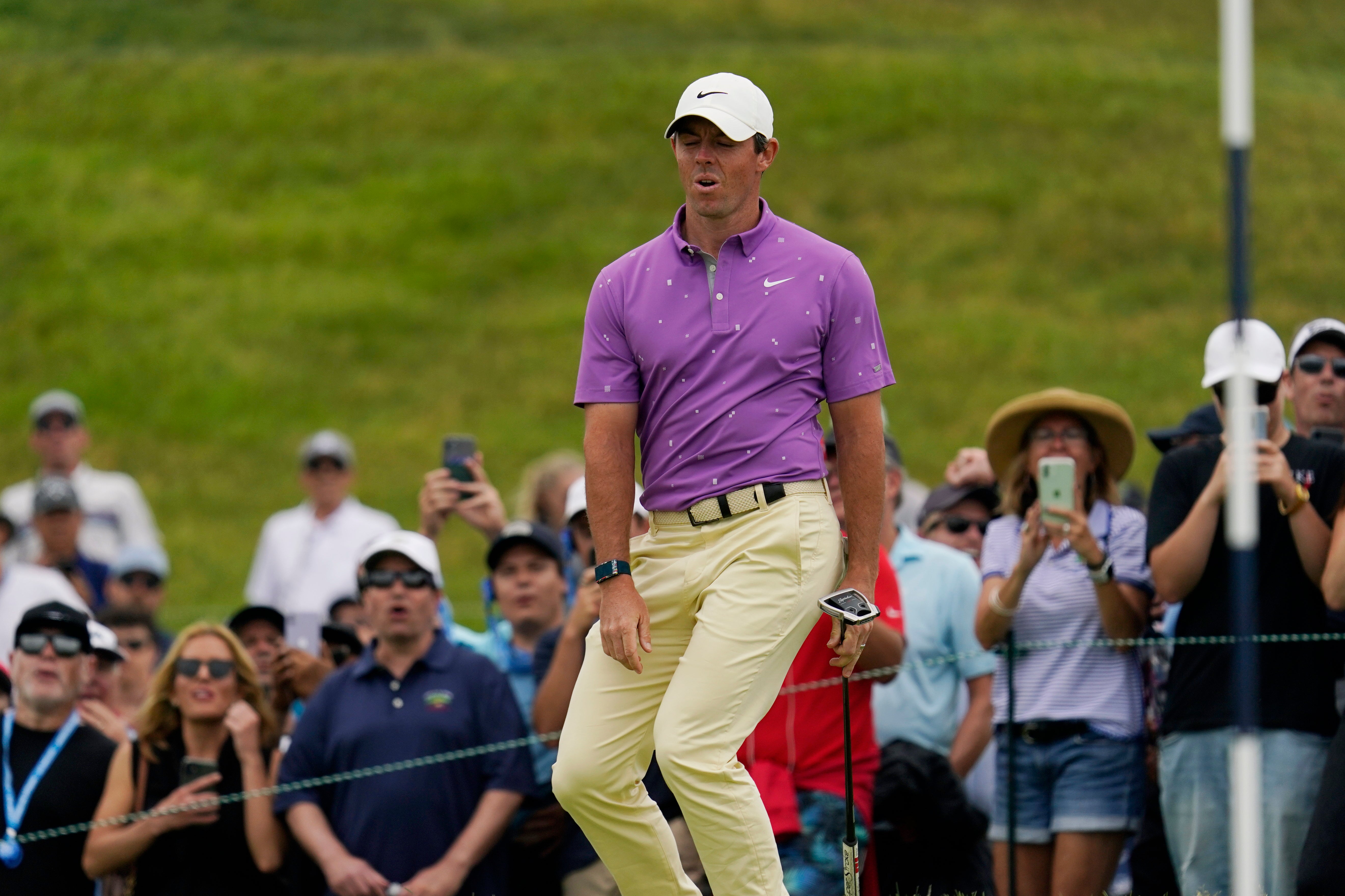Rory McIlroy reacts after missing a putt on the fifth green during the final round of the US Open
