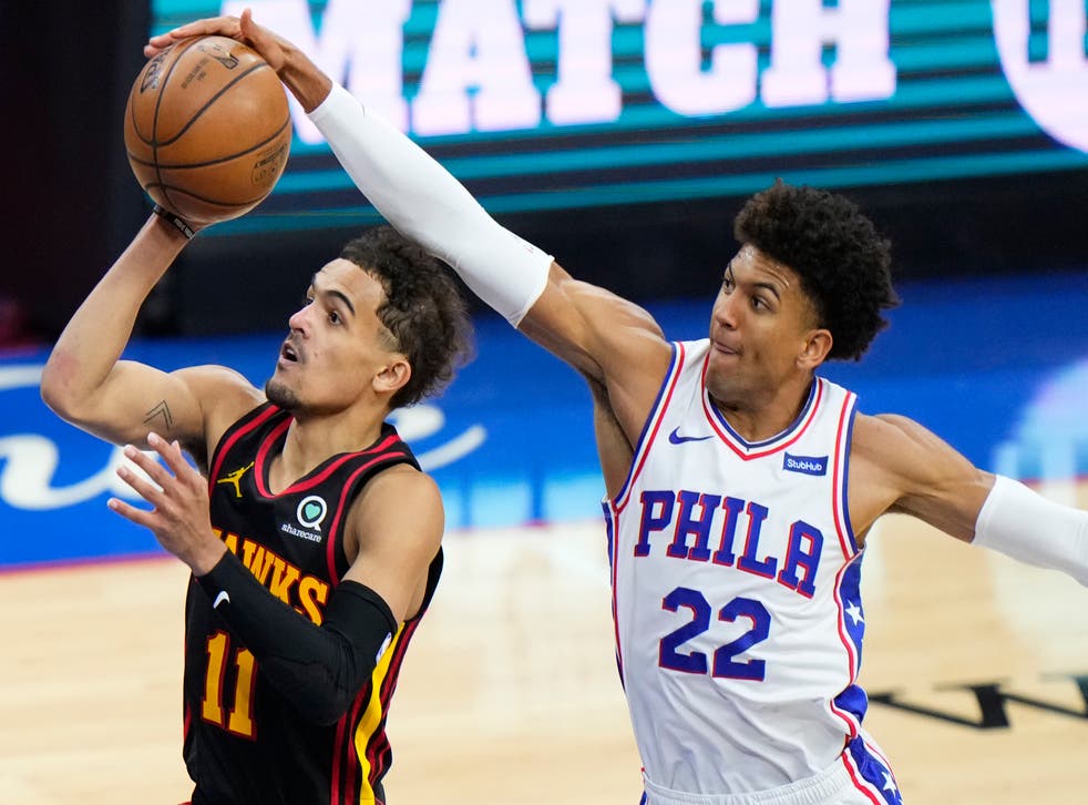 Philadelphia 76ers’ Matisse Thybulle, right, blocks a shot by Atlanta Hawks’ Trae Young during the second half of Game 7
