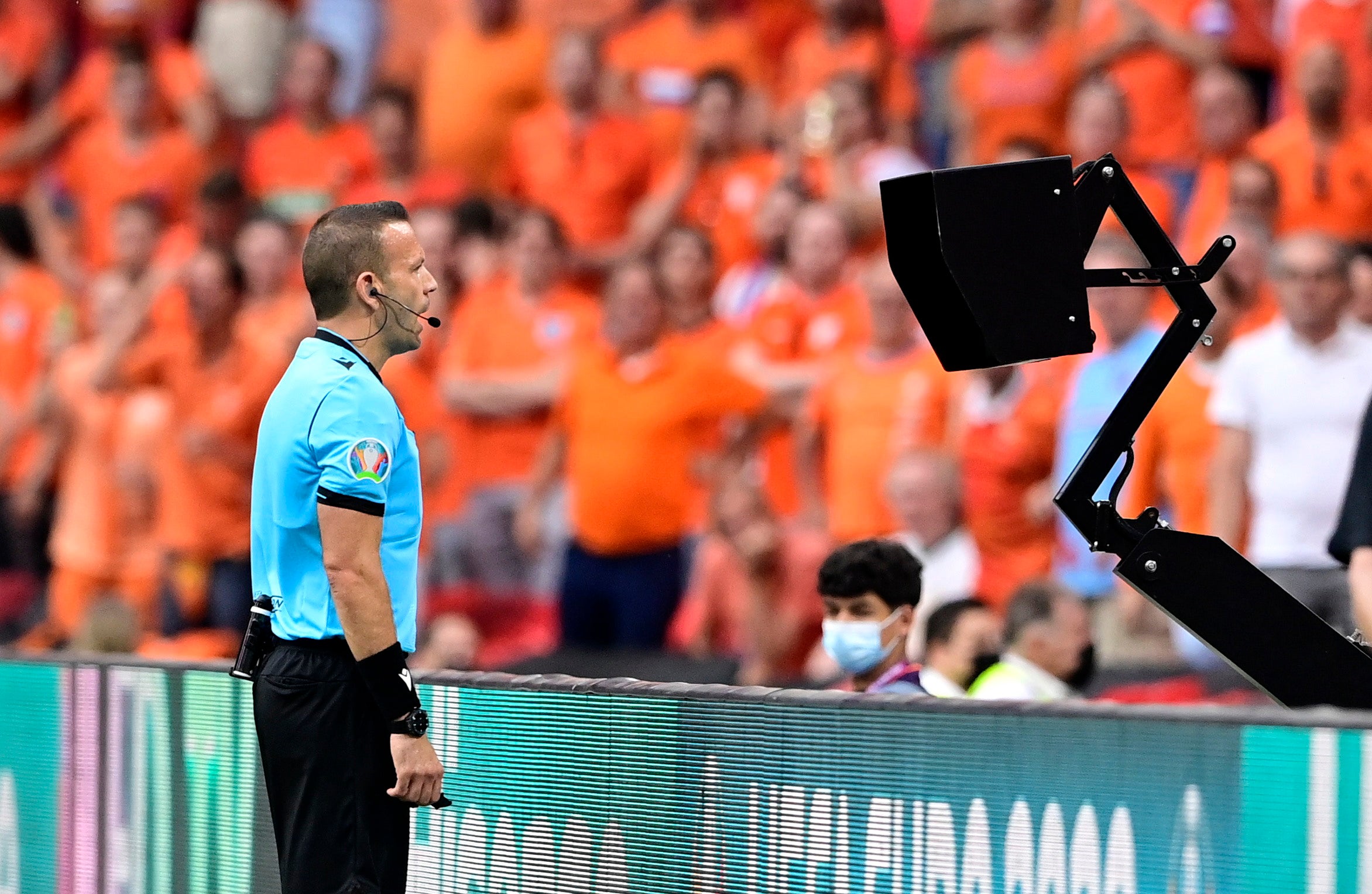 Referee Orel Grinfeld prepares to award a penalty to the Netherlands against Austria