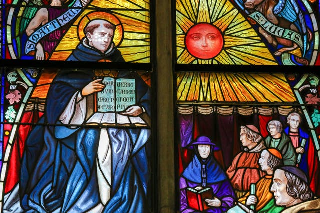 <p>Window onto faith: a stained glass depiction of Saint Thomas Aquinas in the Cathedral of Mechelen, Belgium</p>