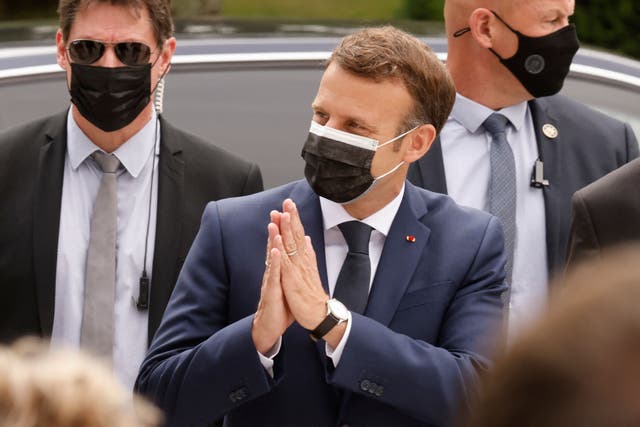 <p>The French president, Emmanuel Macron, casts his vote at a polling station in Le Touquet on Sunday in the first round of the French regional elections</p>