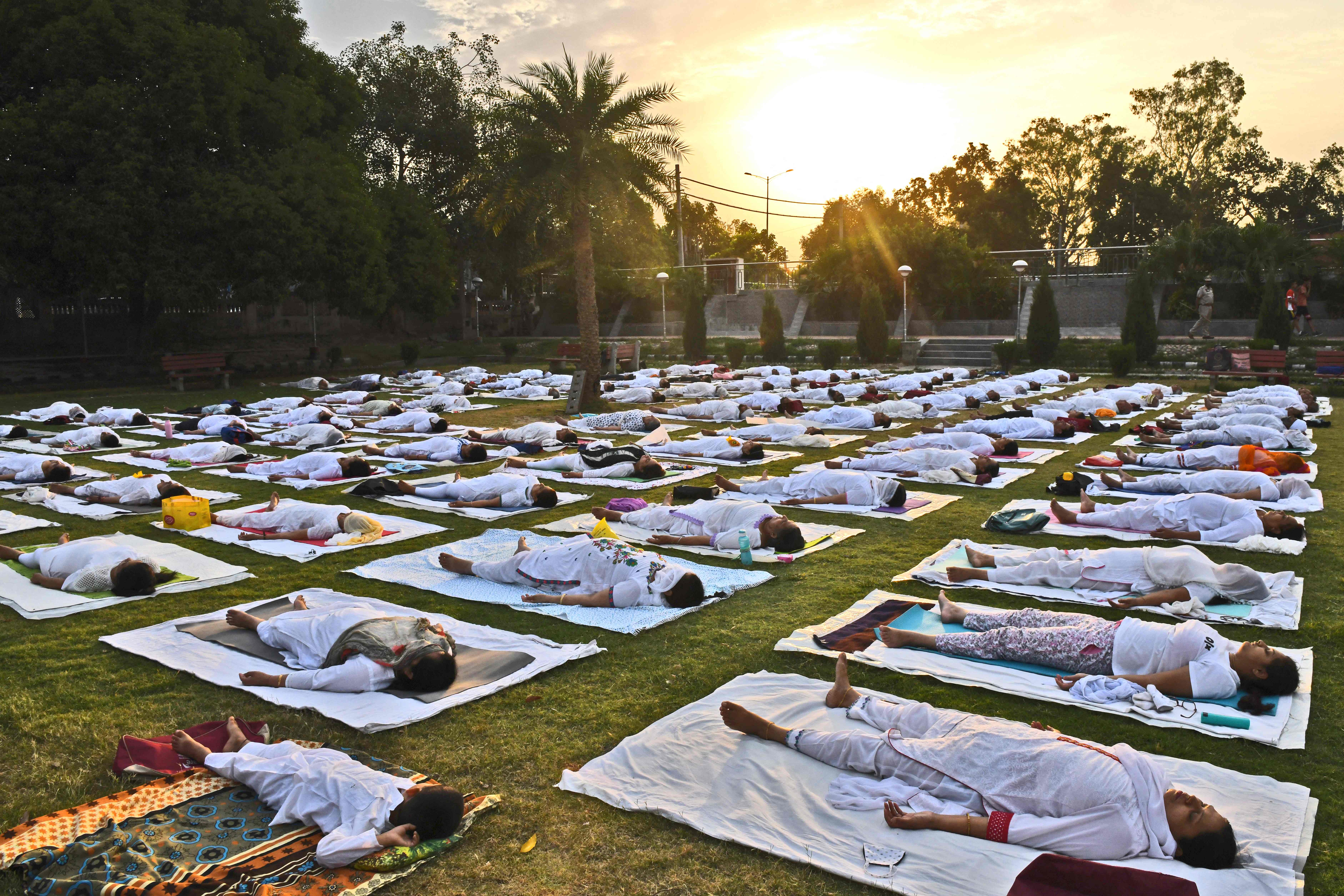 People take part in a yoga session at a park in Amritsar to mark International Yoga Day.