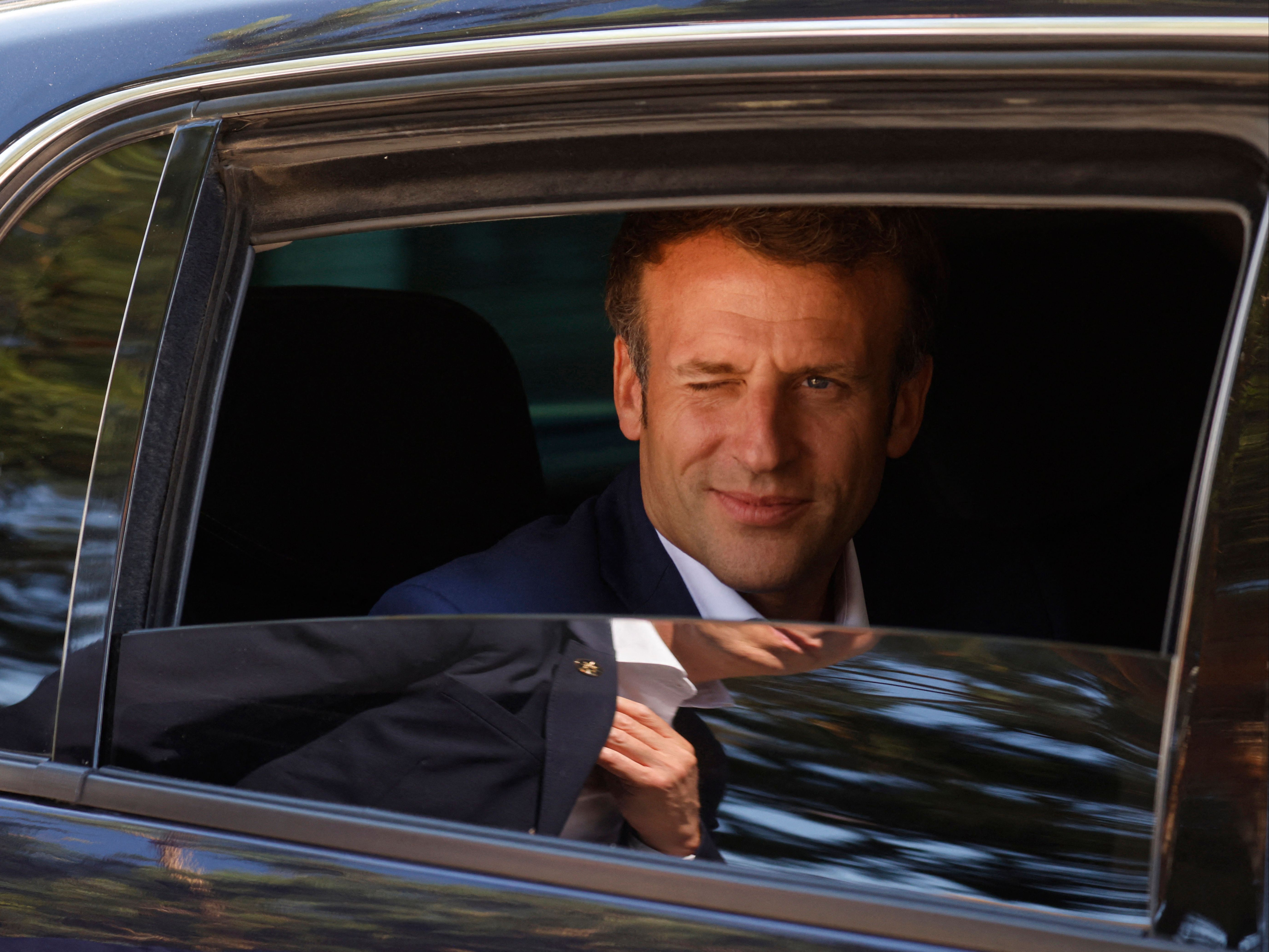 Macron leaves his family home in Le Touquet, after he voted in the first round of the French regional elections