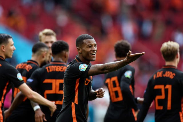 <p>Georginio Wijnaldum celebrates after scoring Holland's second goal against North Macedonia</p>