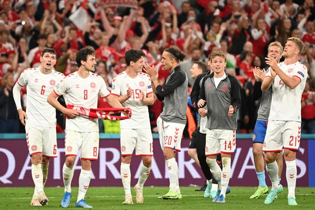 <p>Denmark players celebrate after the 4-1 win over Russia. (Jonathan Nackstrand/AP).</p>