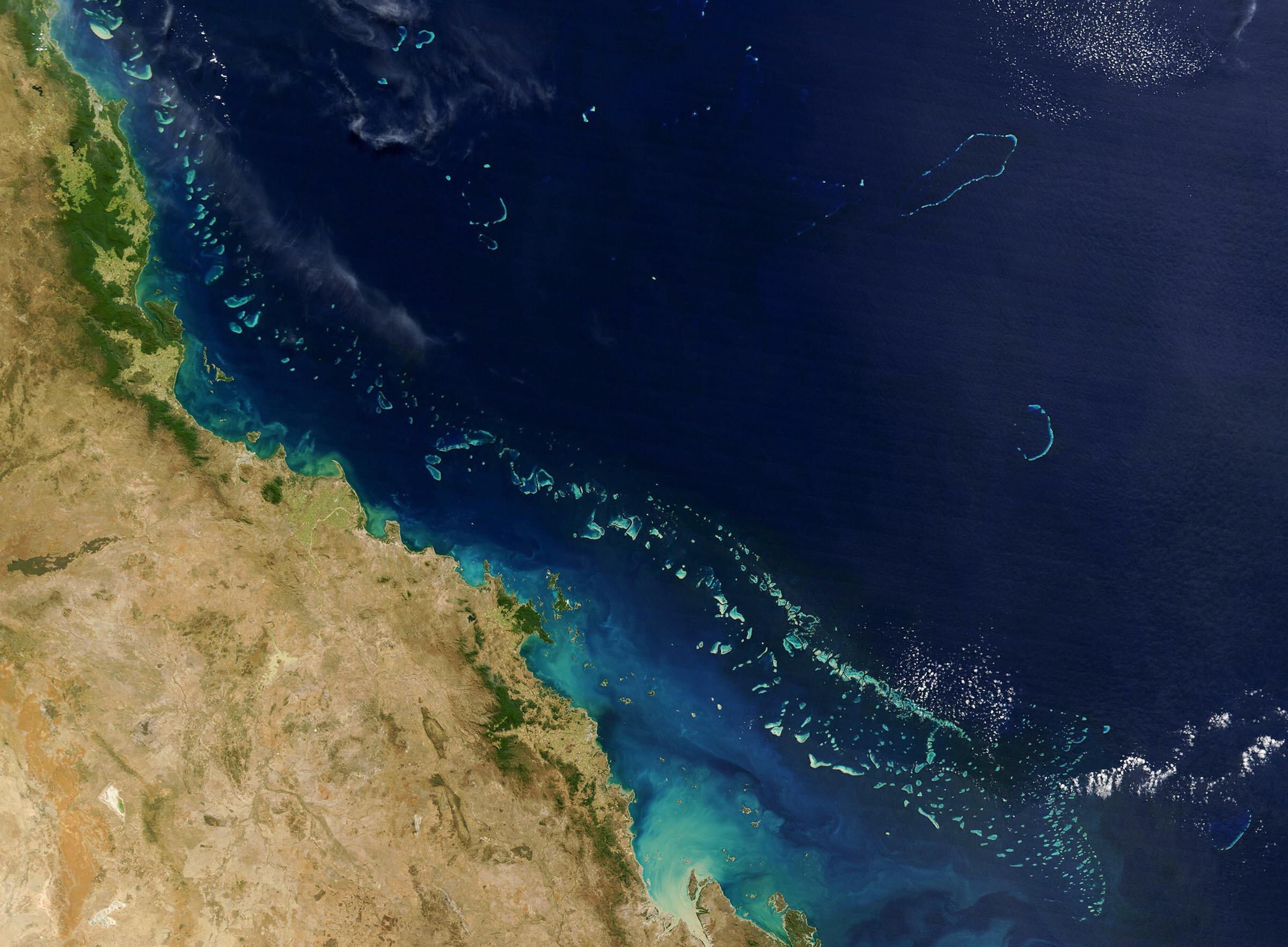 Stretching along more than 2,000 km (1,200 miles) of Australia’s eastern coast is one of the world’s formost natural wonders - The Great Barrier Reef (Light blue) seen here in this 06 August, 2004 NASA satellite image.