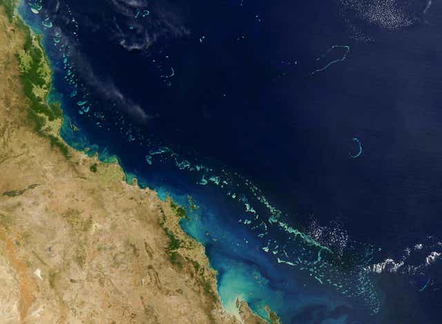 <p>Stretching along more than 2,000 km (1,200 miles) of Australia’s eastern coast is one of the world’s formost natural wonders - The Great Barrier Reef (Light blue) seen here in this 06 August, 2004 NASA satellite image.</p>