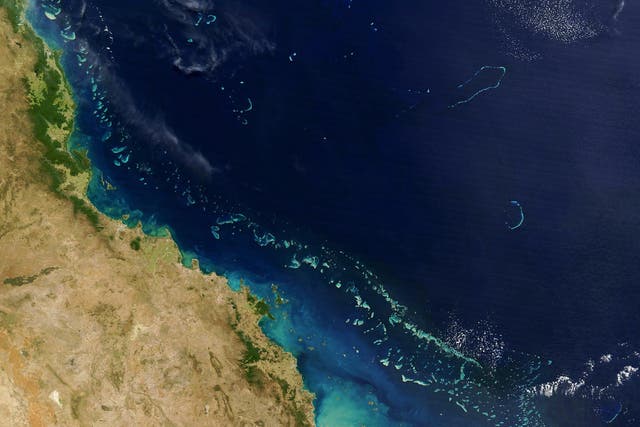 <p>Stretching along more than 2,000 km (1,200 miles) of Australia’s eastern coast is one of the world’s formost natural wonders - The Great Barrier Reef (Light blue) seen here in this 06 August, 2004 NASA satellite image.</p>
