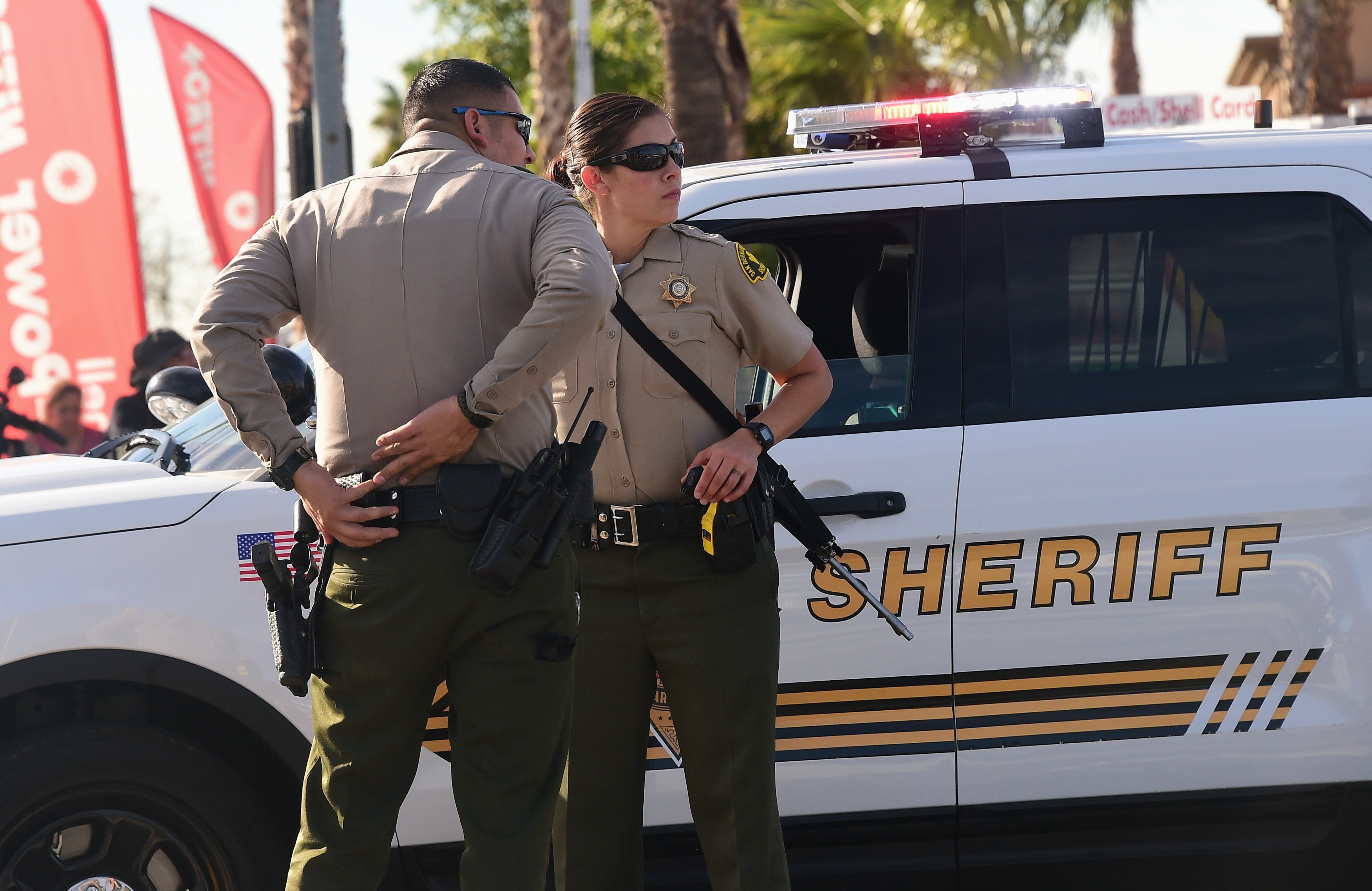 Armed officers from the Sheriff’s department on patrol near the scene of the crime in San Bernardino, California