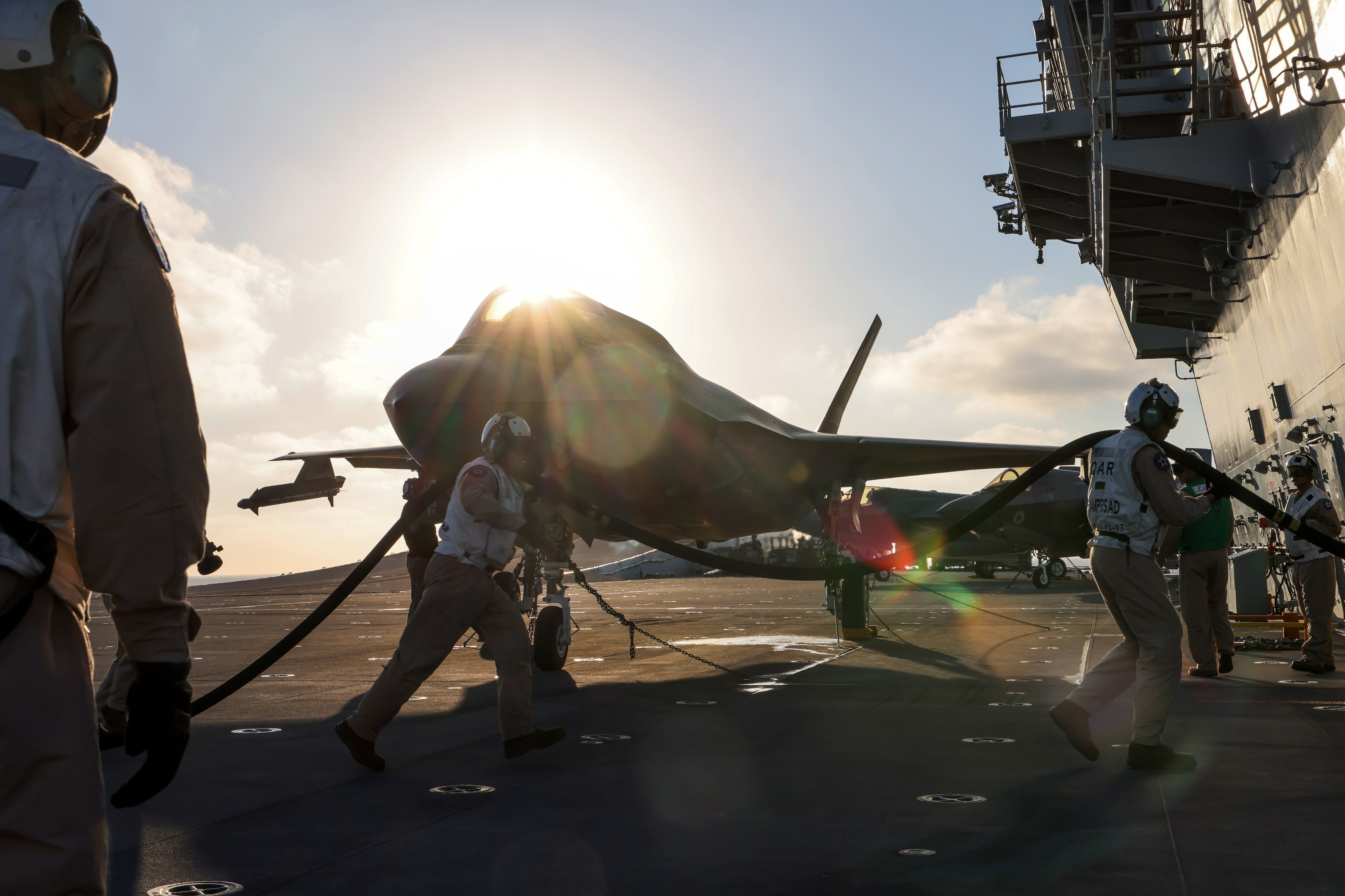 Crew prepare an F35B Lightning Jet for a launch from HMS Queen Elizabeth