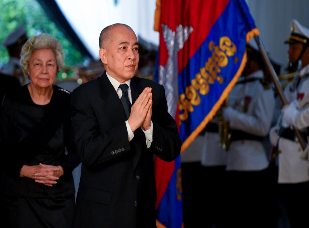 <p>Cambodia’s King Norodom Sihamoni (C) and his mother former queen Monique (L)</p>
