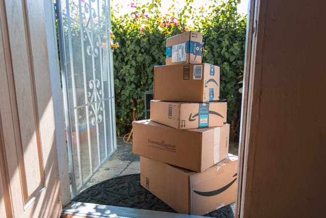 <p>Amazon packages on the doorstep </p>