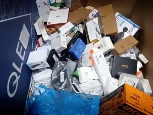 Various technology products they found sorted into boxes marked "destroy" at the Amazon Fulfilment Centre in Dunfermline, Fife