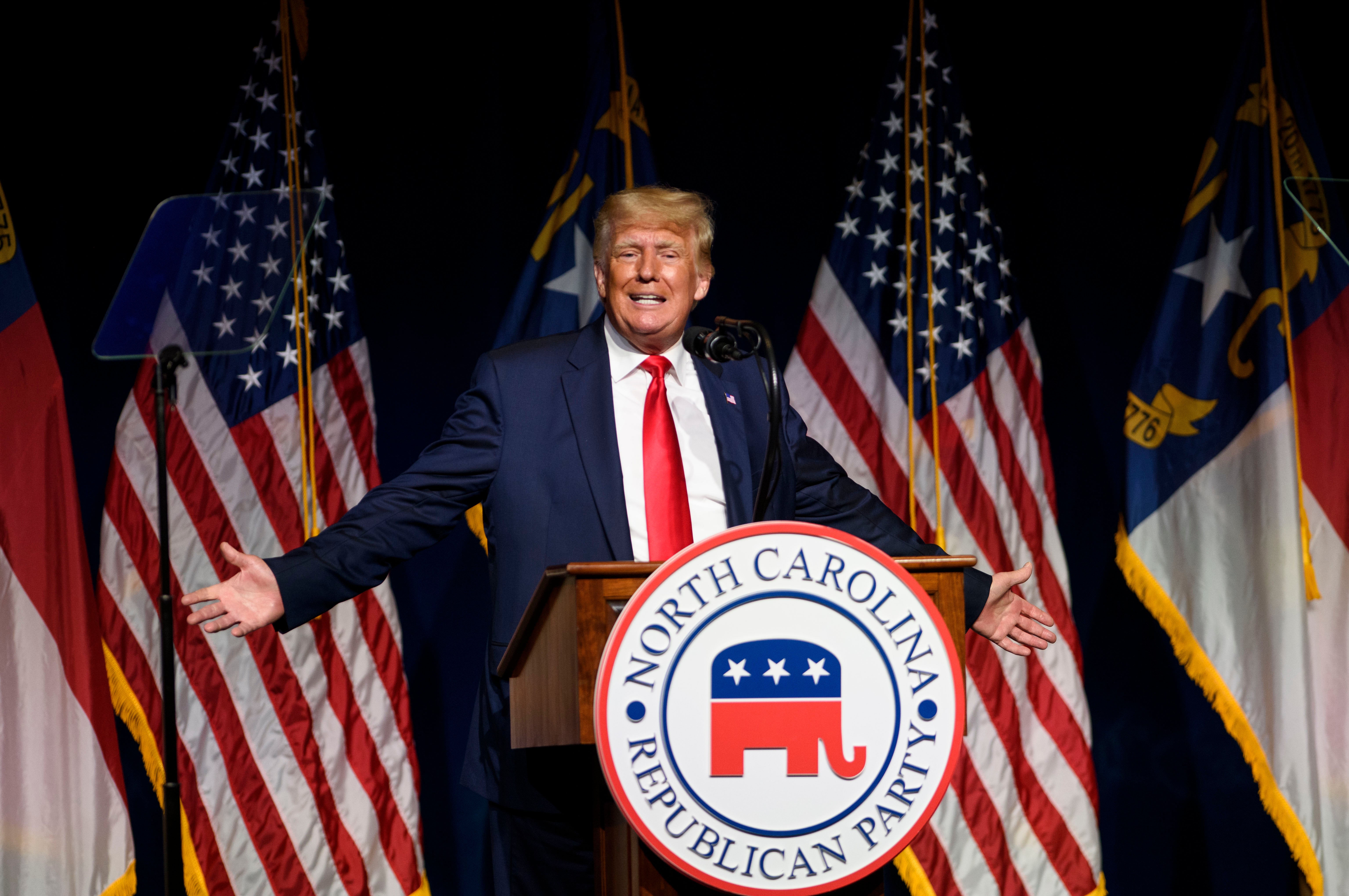 Former US President Donald Trump addresses the NCGOP state convention on 5 June, 2021 in Greenville, North Carolina. Mr Trump could end up getting legal defense from President Joe Biden’s Justice Department.