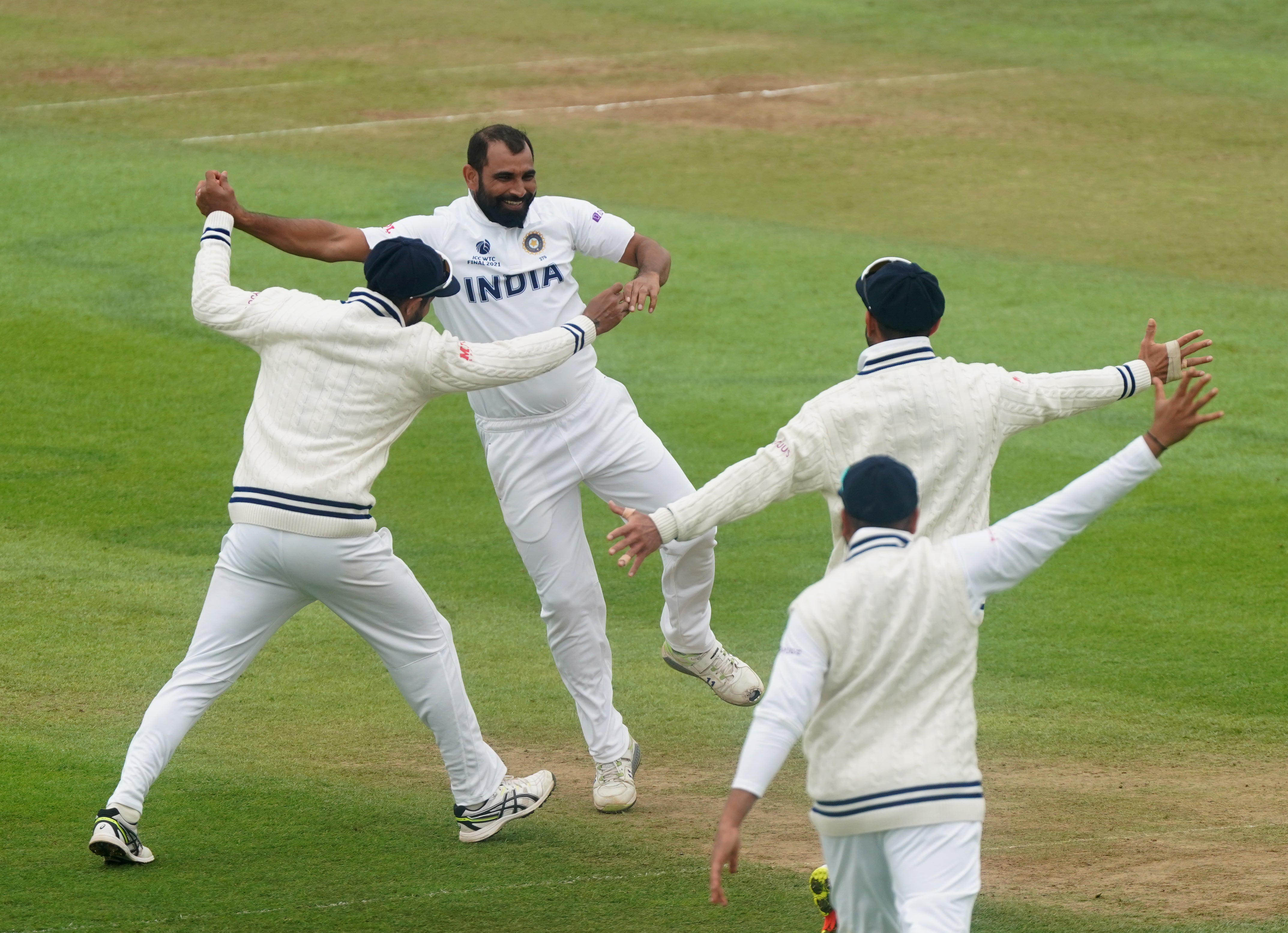 Mohammed Shami, centre left, celebrates the wicket of BJ Watling, not pictured