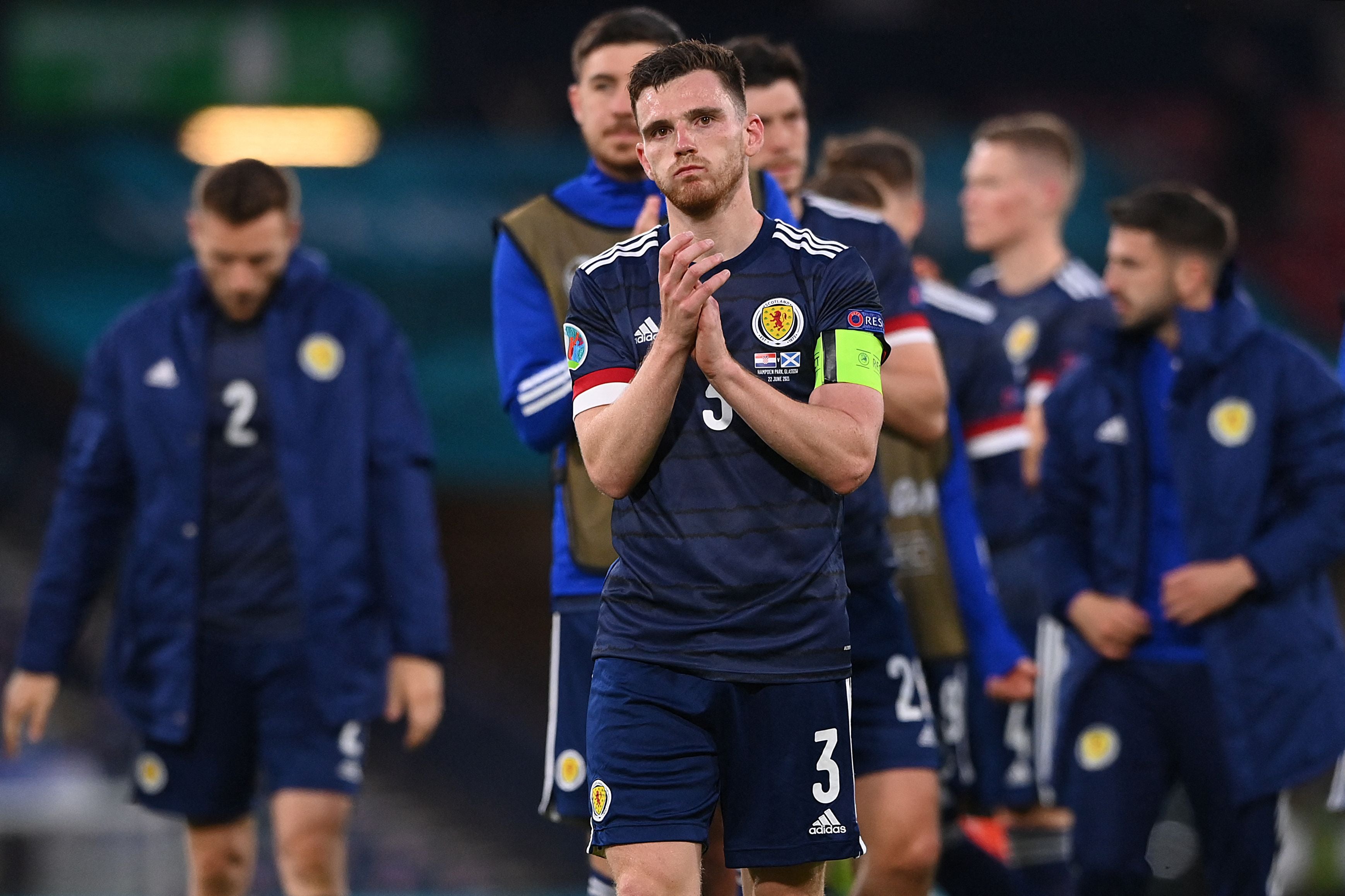 Captain Andy Robertson with his beaten Scotland teammates