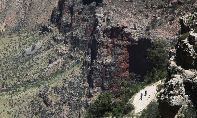 <p>Visitors hike on Memorial Day in the South Rim of Grand Canyon National Park, which has partially reopened on weekends amid the coronavirus (COVID-19) pandemic, on May 25, 2020 in Grand Canyon National Park, Arizona</p>