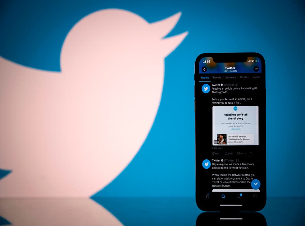 <p>Photograph taken on 26 October, 2020, shows the logo of US social network Twitter displayed on the screen of a smartphone and a tablet in Toulouse, southern France</p>