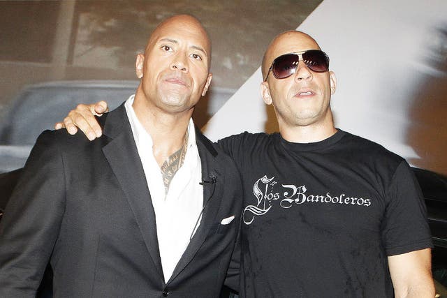 <p>Dwayne Johnson and Vin Diesel at a ‘Fast Five’ premiere in 2011</p>