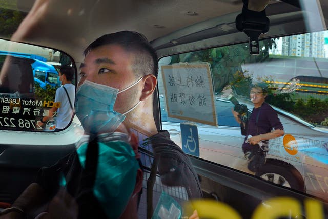 <p>File: Tong Ying-kit arrives at a court in a police van in Hong Kong on 6 July, 2020</p>