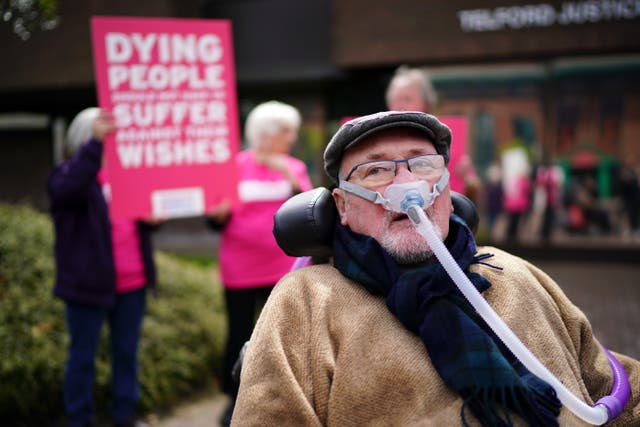 <p>Motor neurone disease sufferer Noel Conway, 67, poses for the media outside Telford County Court</p>
