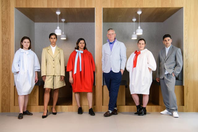 <p>Giles Deacon (third from right) with models wearing the future of office wear by Giles Deacon for IWG</p>