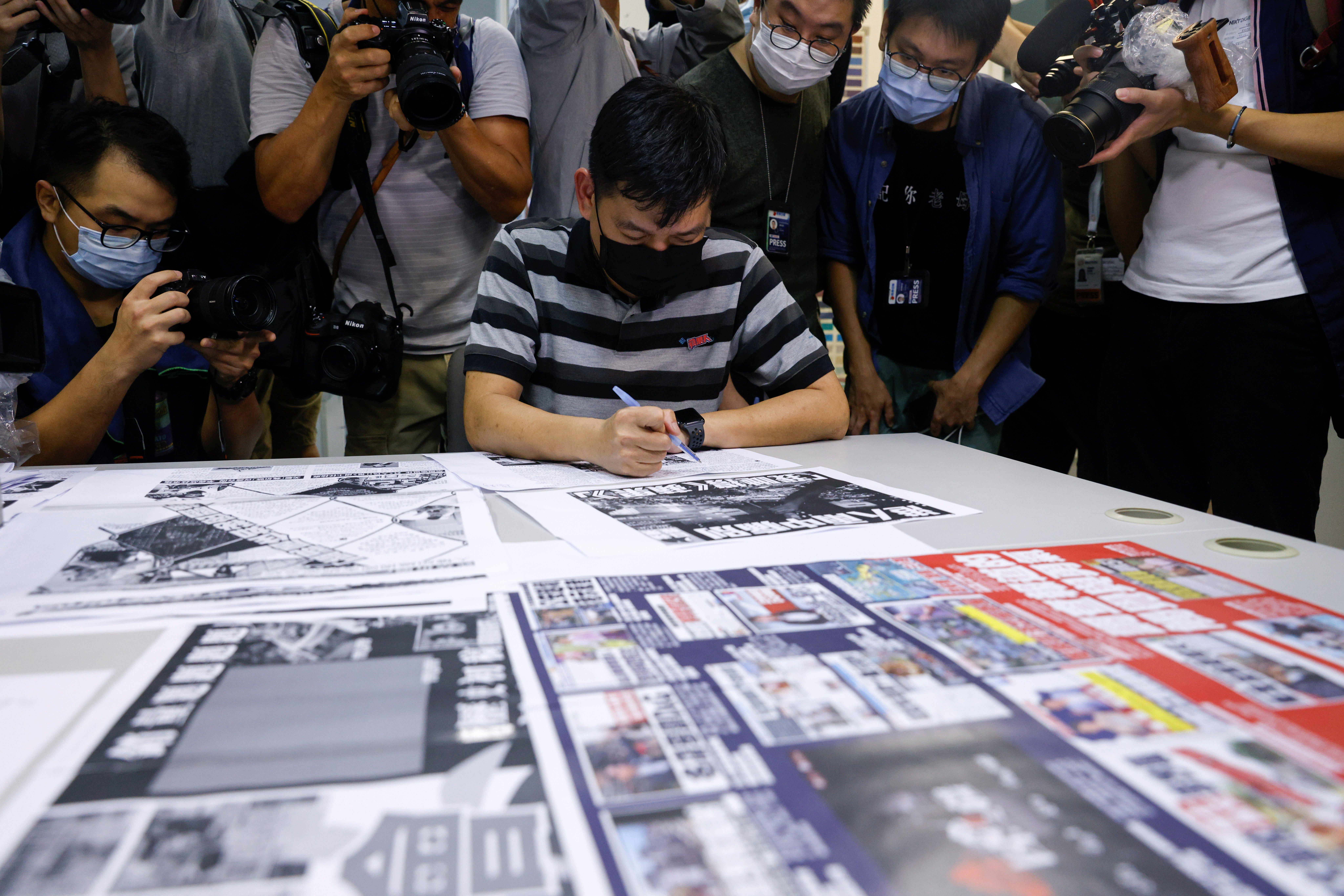 Lam Man-Chung, executive editor-in-chief of Apple Daily, works on the final edition of the newspaper