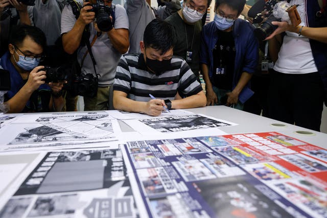 <p>Lam Man-Chung, executive editor-in-chief of Apple Daily, works on the final edition of the newspaper</p>