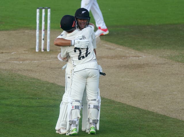 Kane Williamson (right) and Ross Taylor celebrate winning the match