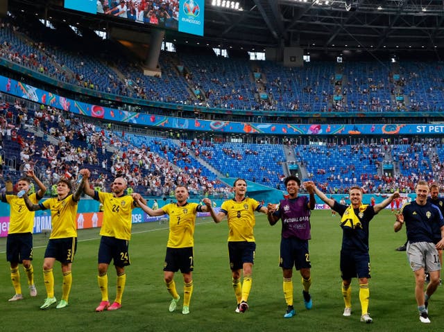 <p>Sweden players celebrate at full-time after finishing with seven points</p>