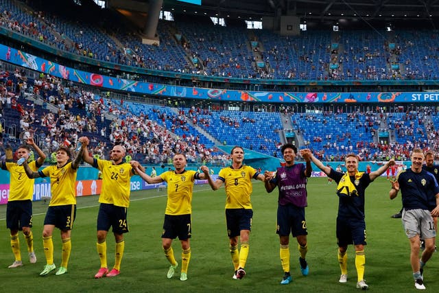 <p>Sweden players celebrate at full-time after finishing with seven points</p>