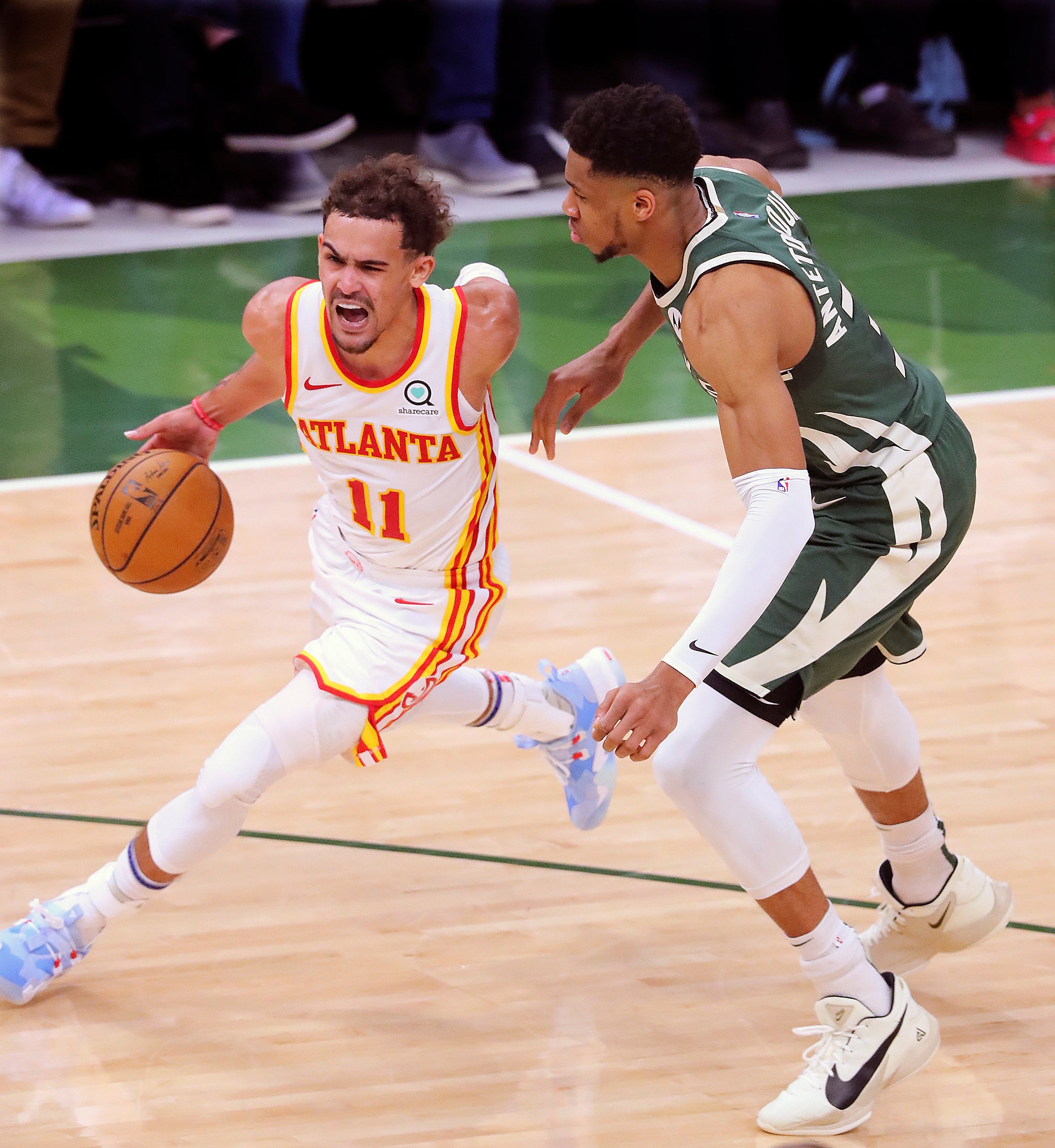 Trae Young, left, exploded with an enormous 48 points as his Atlanta Hawks claimed the first game of the Eastern Conference Finals 116-113 over the Milwaukee Bucks