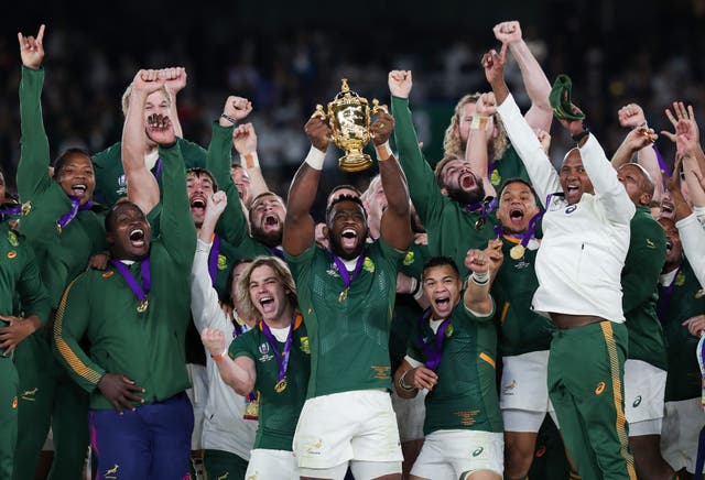 <p>South Africa lift the World Cup trophy</p>