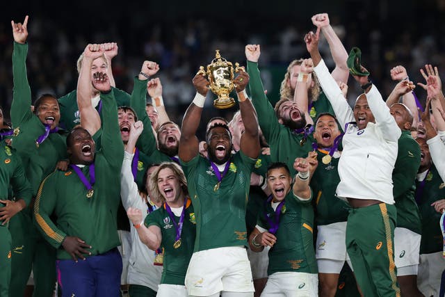 <p>South Africa lift the World Cup trophy</p>